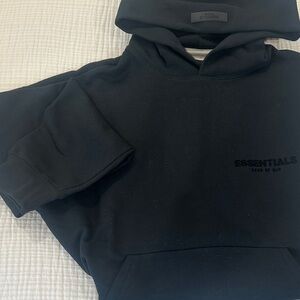Fear of God Essentials Black Hoodie with Black Lettering